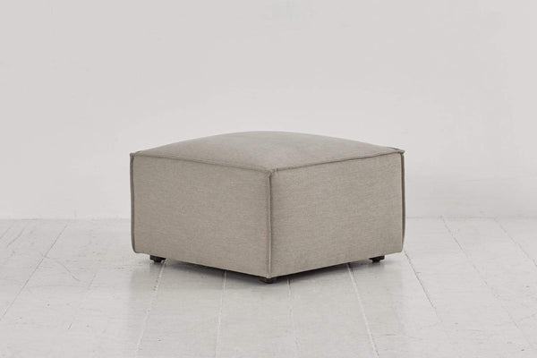 Pumice image 2 - Model 03 Ottoman in Pumice Linen Side Angle View