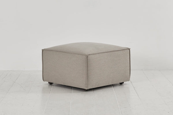 Pumice image 2 - Model 03 Ottoman in Pumice Linen Side Angle View